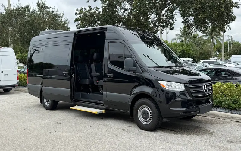 Black Mercedes-Benz Sprinter with the sliding door open